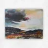 Dramatic acrylic landscape with a dark storm cloud, warm gold sky and orange, red and teal land by Julie Tugwell.