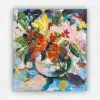 Small acrylic still life of orange, red and pink flowers with green leaves in a vase on blue by Julie Tugwell.